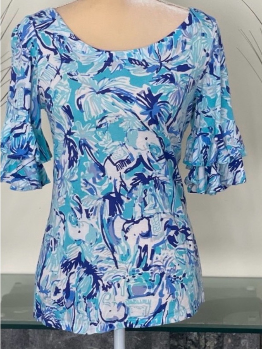 Lilly Pulitzer Lula top in a blue and white "Elephant Appeal" floral print.